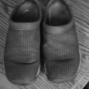 Black slip on shoes.